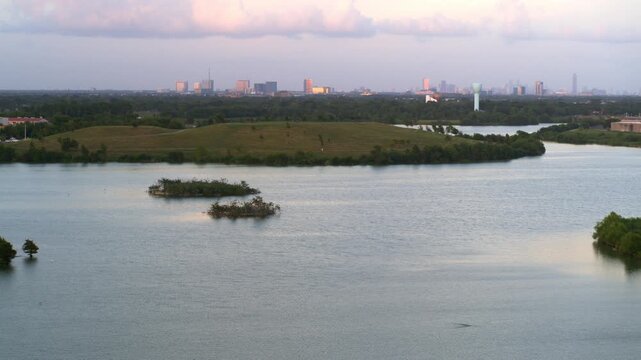 &ldquo;Drone view of bayou reservoir in Southwest Houston with cityscape background