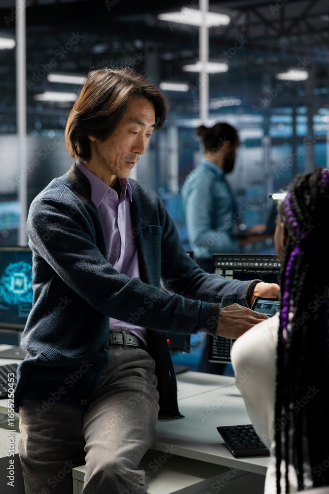 Poster manager and intern in data center troubleshoot server connectivity issues using ai. senior programme