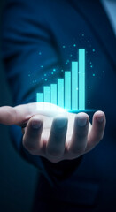 Hand holding glowing teal bar graph, symbolizing growth, success, and progress in business, technology, or finance.  Perfect for presentations or website banners