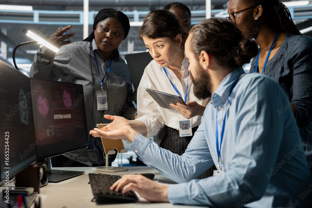Poster data center technicians reacting to virus alert on computer monitor, initiating protocol to protect 