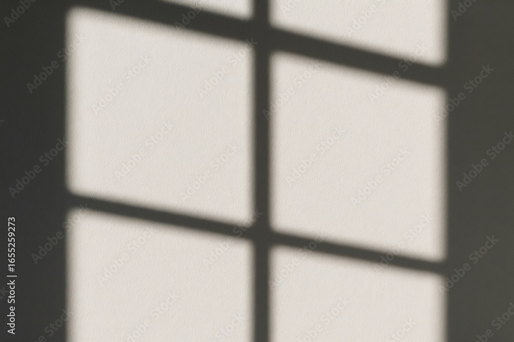 Poster sunlight streaming through a window casts intricate shadows on a white wall, creating a captivating 