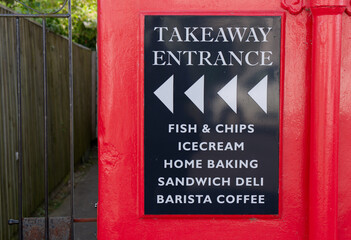 Take away entrance direction sign on wall