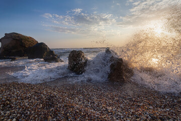 Waves beat on stones on the seashore