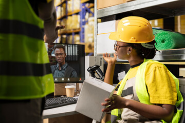 Black female worker chatting with CEO on web online conference, ensuring e-commerce retail activity...