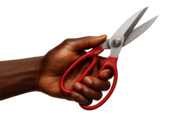 African American hand holding sharp red scissors isolated on transparent background.