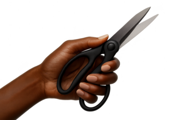 Close-up of a hand holding black office scissors isolated on a transparent background.