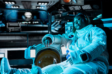 Astronaut lies still in cold spaceship chamber after temperature control failure causes severe heat...