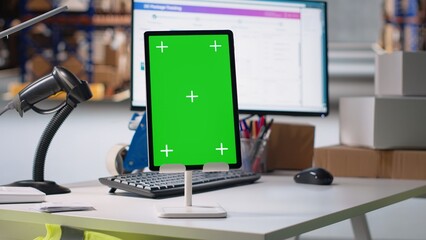 Empty industrial storehouse shows screen with copy space mockup, fulfillment center shipping cargo...