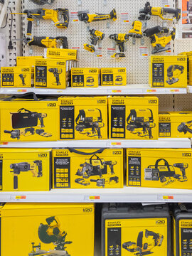 Riga, Latvia - August 13, 2025: Stanley power tools displayed on shelves in a retail store, showcasing various models and accessories for DIY enthusiasts and professionals