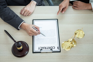 Male lawyer or counselor discussing negotiation legal case with client meeting with document...