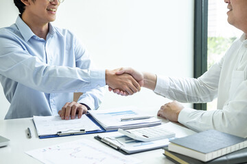 Finishing up a meeting collaboration, handshake of two business people after contract agreement to...