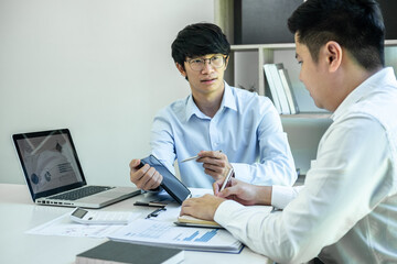 Two business partner team meeting and discussion financial project of investment ideas,...