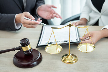 Professional Male lawyer or counselor discussing negotiation legal case with client meeting with document contract in office, law and justice, attorney, lawsuit concept