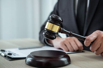 Male lawyer working with legal case document contract in office