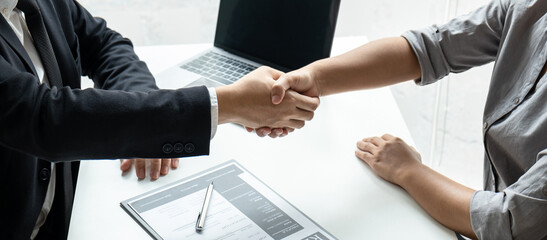 Good deal of interview, Business people and recruiter shaking hands greeting or get acquainted of conducting a job interview while sitting at the working meeting in office