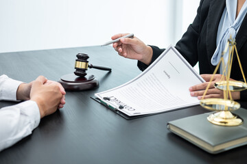Professional Male lawyer or counselor discussing negotiation legal case with client meeting with...
