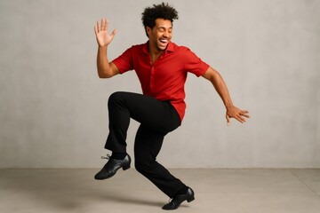 Young male dancer expressing joy and passion while performing energetic salsa steps in a studio