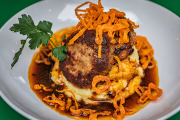 Swiss meat patty with mashed potatoes and fried onions in Zurich, Switzerland