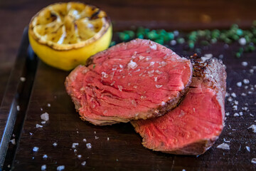 Juicy medium rare steak with sea salt and herbs at a high end Zurich steakhouse