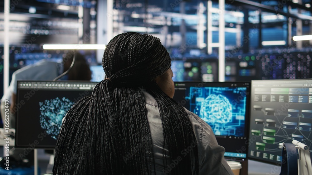 Poster data center staff member in office using ai deep learning algorithms to analyze datasets. african am