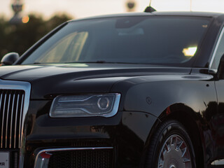 Obraz premium Luxurious Black Sedan with Gleaming Chrome Accents