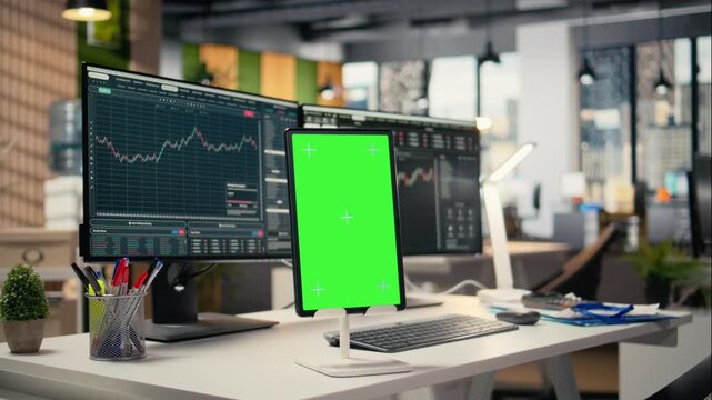 Close up of isolated screen tablet displaying stock market graphs in proprietary firm office. Mockup device on brokerage workspace desk used for stock exchange analysis and strategy planning