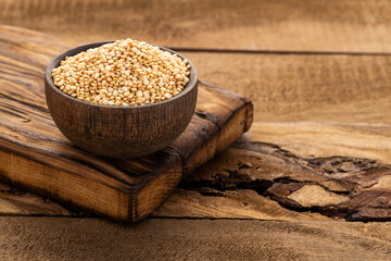 Raw quinoa seeds scattered in a bowl - Chenopodium quinoa