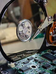 Open old hard disk drive including platter read/write head and circuit board