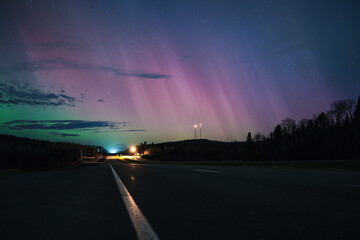 Quiet Road Under Aurora Lights at Dusk