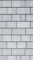 Obraz premium Light gray rectangular tiles create a repeating pattern