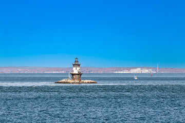 lighthouse in the bay near town of Orient
