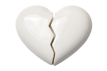 A stark white ceramic heart, shattered into two pieces, symbolizing heartbreak and lost love, isolated against a plain white background.
