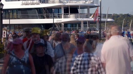 Time-lapse unrecognizable blurry huge crowd of people crossing city street,Halifax Residents And Tourists Move In High-Speed Flow On City Streets.Reveals Blurred Steps, City Human Patterns. 