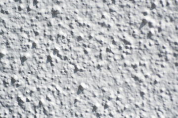 Macro shot of white rough wall texture as background
