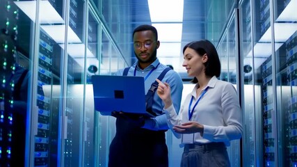 Data center technicians collaborating on cloud infrastructure management system