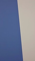 A close up of a blue and white wall.