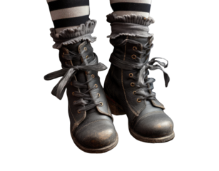 Close-up of dark boots and striped socks