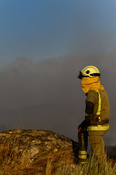 The Silhouette of a Firefighter Against a Smoky Sky. Concept A heroic and cinematic image.