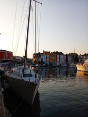 Colorful houses with boats on an island resembling Venice, Italy, in summer