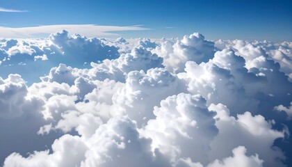 High-altitude view of dense white clouds against a vibrant blue sky