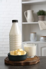 Different dairy products on gray textured table in kitchen
