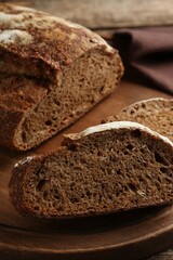Pieces of fresh rye bread on table, closeup
