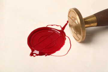 Beautiful wax stamp and red seal on paper, closeup