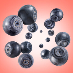 Fresh ripe blueberries swirling in air against coral gradient background