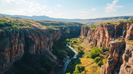 Spectacular canyon landscape with flowing river and rugged cliffs captured in golden light showcasing the raw beauty