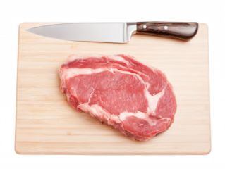 Raw steak with intricate marbling on a light wooden cutting board with a chef's knife isolated on transparent background