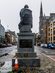 Back of the statue of James Clerk Maxwell located on George Street in Edinburgh, Scotland