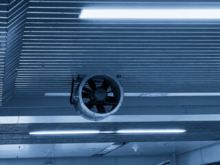Industrial Ceiling Fan in Modern Architecture with Ambient Lighting