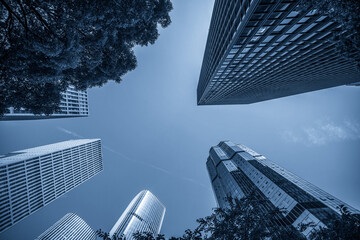 Captivating Low-Angle View of Modern Skyscrapers Against a Blue Sky