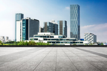 Modern Urban Skyline with Clear Blue Skies and Concrete Plaza